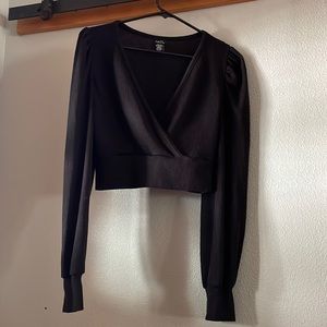 Black half wrap long sleeve crop top.